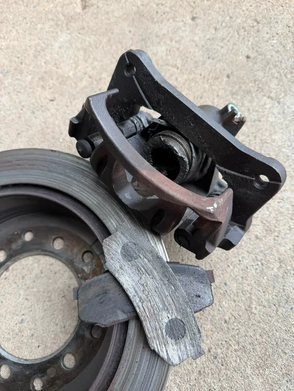 Removed worn brake components from a real Ashtech Mechanical brake repair.